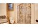 Attractive bathroom with tiled shower, glass door, and marble-look vanity at 6120 Kings Brook Ct, Las Vegas, NV 89149