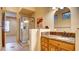 Bathroom features a glass shower, vanity with drawers and decorative mirror at 6120 Kings Brook Ct, Las Vegas, NV 89149