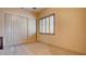 Neutral bedroom featuring closet with bifold doors and plantation shutters at 6120 Kings Brook Ct, Las Vegas, NV 89149
