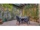 Inviting courtyard seating area surrounded by lush greenery and a trellis structure at 6120 Kings Brook Ct, Las Vegas, NV 89149