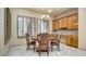 Charming dining room with wood furniture, shuttered windows, and elegant chandelier at 6120 Kings Brook Ct, Las Vegas, NV 89149