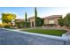 Attractive single-story home with manicured landscaping, artificial turf, and stone accents at 6120 Kings Brook Ct, Las Vegas, NV 89149