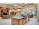 Open kitchen overlooking the living room, featuring stainless steel appliances and granite countertops at 6120 Kings Brook Ct, Las Vegas, NV 89149