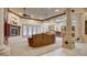 Spacious living room featuring a fireplace, high ceilings, and seamless transition to the kitchen at 6120 Kings Brook Ct, Las Vegas, NV 89149