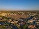 Panoramic aerial view of a suburban neighborhood with mountain views in the distance at 6120 Kings Brook Ct, Las Vegas, NV 89149