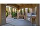 Covered patio with outdoor kitchen and beautifully landscaped backyard at 6120 Kings Brook Ct, Las Vegas, NV 89149