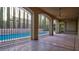 Inviting covered patio overlooking the pool with ornate wrought iron gates at 6120 Kings Brook Ct, Las Vegas, NV 89149