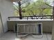 Private balcony offering a relaxing outdoor space with views of the surrounding trees at 656 Peachy Canyon Cir # 203, Las Vegas, NV 89144