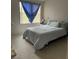 A comfortable bedroom offers a cozy retreat with its neutral palette and natural light at 656 Peachy Canyon Cir # 203, Las Vegas, NV 89144