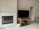 Comfortable living room with a decorative fireplace and access to other rooms at 656 Peachy Canyon Cir # 203, Las Vegas, NV 89144