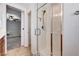 Bathroom features a walk-in shower with tile surround at 7704 Lots Hills Dr, Las Vegas, NV 89179