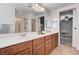 Bathroom features a double sink vanity, a walk-in shower, and neutral paint at 7704 Lots Hills Dr, Las Vegas, NV 89179