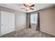 This bedroom features a ceiling fan and a closet with sliding doors, great for storage at 7704 Lots Hills Dr, Las Vegas, NV 89179