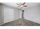 This bedroom features neutral paint, carpet, a closet and direct access to another room at 7704 Lots Hills Dr, Las Vegas, NV 89179