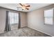 Bedroom with neutral walls, carpet, and natural light at 7704 Lots Hills Dr, Las Vegas, NV 89179