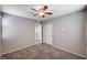 This bedroom features neutral walls, carpeting, and a closet with sliding doors at 7704 Lots Hills Dr, Las Vegas, NV 89179