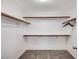 Walk-in closet with carpet flooring and shelving for optimal storage at 7704 Lots Hills Dr, Las Vegas, NV 89179