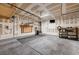 This garage has ample storage space, a roll-up door and a place to work at 7704 Lots Hills Dr, Las Vegas, NV 89179