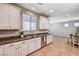 Spacious kitchen with granite countertops, stainless steel appliances, and a view to the living area at 7704 Lots Hills Dr, Las Vegas, NV 89179