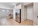Bright, modern kitchen with stainless steel refrigerator, granite countertops and white cabinets at 7704 Lots Hills Dr, Las Vegas, NV 89179