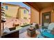 Cozy covered patio with comfortable seating area, perfect for outdoor relaxation and entertaining at 7704 Lots Hills Dr, Las Vegas, NV 89179