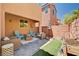 This patio has comfortable wicker seating to enjoy the outdoor weather at 7704 Lots Hills Dr, Las Vegas, NV 89179