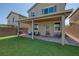 Nice backyard featuring a covered patio, pavers, artificial grass, and privacy walls at 7720 Houston Peak St, Las Vegas, NV 89166