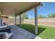 Enjoy the backyard featuring covered patio, pavers, and artificial turf for low maintenance relaxation and fun at 7720 Houston Peak St, Las Vegas, NV 89166
