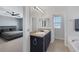 This elegant bathroom features a double sink vanity with granite countertops and modern fixtures at 7720 Houston Peak St, Las Vegas, NV 89166