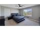 This bedroom boasts a modern platform bed, neutral color palette, and a large window for plenty of light at 7720 Houston Peak St, Las Vegas, NV 89166
