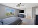 Bright Primary bedroom features a large window, en-suite bathroom, and generous closet space at 7720 Houston Peak St, Las Vegas, NV 89166