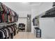 Walk-in closet with plenty of space for organization, built-in shelving, and hanging racks at 7720 Houston Peak St, Las Vegas, NV 89166