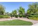 Picturesque common area featuring manicured landscaping, walking paths, and park benches at 7720 Houston Peak St, Las Vegas, NV 89166