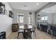 Cozy dining area with a wooden table, chairs, and a barrel accent at 7720 Houston Peak St, Las Vegas, NV 89166