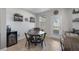 Comfortable dining area featuring a wood table, chairs, and a beverage cooler at 7720 Houston Peak St, Las Vegas, NV 89166