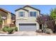 Charming two-story home featuring a gray color palette and a two-car garage at 7720 Houston Peak St, Las Vegas, NV 89166