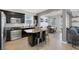 Open kitchen featuring stainless steel appliances, a center island with seating, and tile floors at 7720 Houston Peak St, Las Vegas, NV 89166