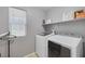Functional laundry room with modern appliances and a window for natural light at 7720 Houston Peak St, Las Vegas, NV 89166