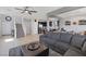 Open-concept living space featuring a staircase and access to the kitchen and dining area at 7720 Houston Peak St, Las Vegas, NV 89166