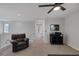 Open loft area with a comfortable chair and view of the stairs at 7720 Houston Peak St, Las Vegas, NV 89166
