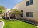Charming backyard featuring a manicured lawn, privacy fence, and covered patio at 7924 Mcdowell Dr, Las Vegas, NV 89129