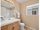 Traditional bathroom featuring a white vanity, framed mirror and shower over tub at 7924 Mcdowell Dr, Las Vegas, NV 89129