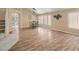 Well-lit dining area featuring sleek hardwood flooring and bright windows at 7924 Mcdowell Dr, Las Vegas, NV 89129