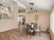 Open-concept dining area featuring hardwood floors, modern lighting, and views to the living space at 7924 Mcdowell Dr, Las Vegas, NV 89129