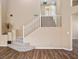 Bright and airy entryway with hardwood floors, staircase, and neutral paint at 7924 Mcdowell Dr, Las Vegas, NV 89129