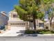 Inviting two-story home featuring a two-car garage and well-maintained front yard at 7924 Mcdowell Dr, Las Vegas, NV 89129