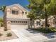 Charming two-story home with a well-manicured lawn and a spacious two-car garage at 7924 Mcdowell Dr, Las Vegas, NV 89129