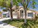 Attractive two-story home featuring a well-kept lawn and attached two car garage at 7924 Mcdowell Dr, Las Vegas, NV 89129