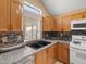 Close-up of kitchen featuring granite countertops and stainless appliances at 7924 Mcdowell Dr, Las Vegas, NV 89129