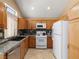 Neutral kitchen with light wood cabinets and granite countertops at 7924 Mcdowell Dr, Las Vegas, NV 89129